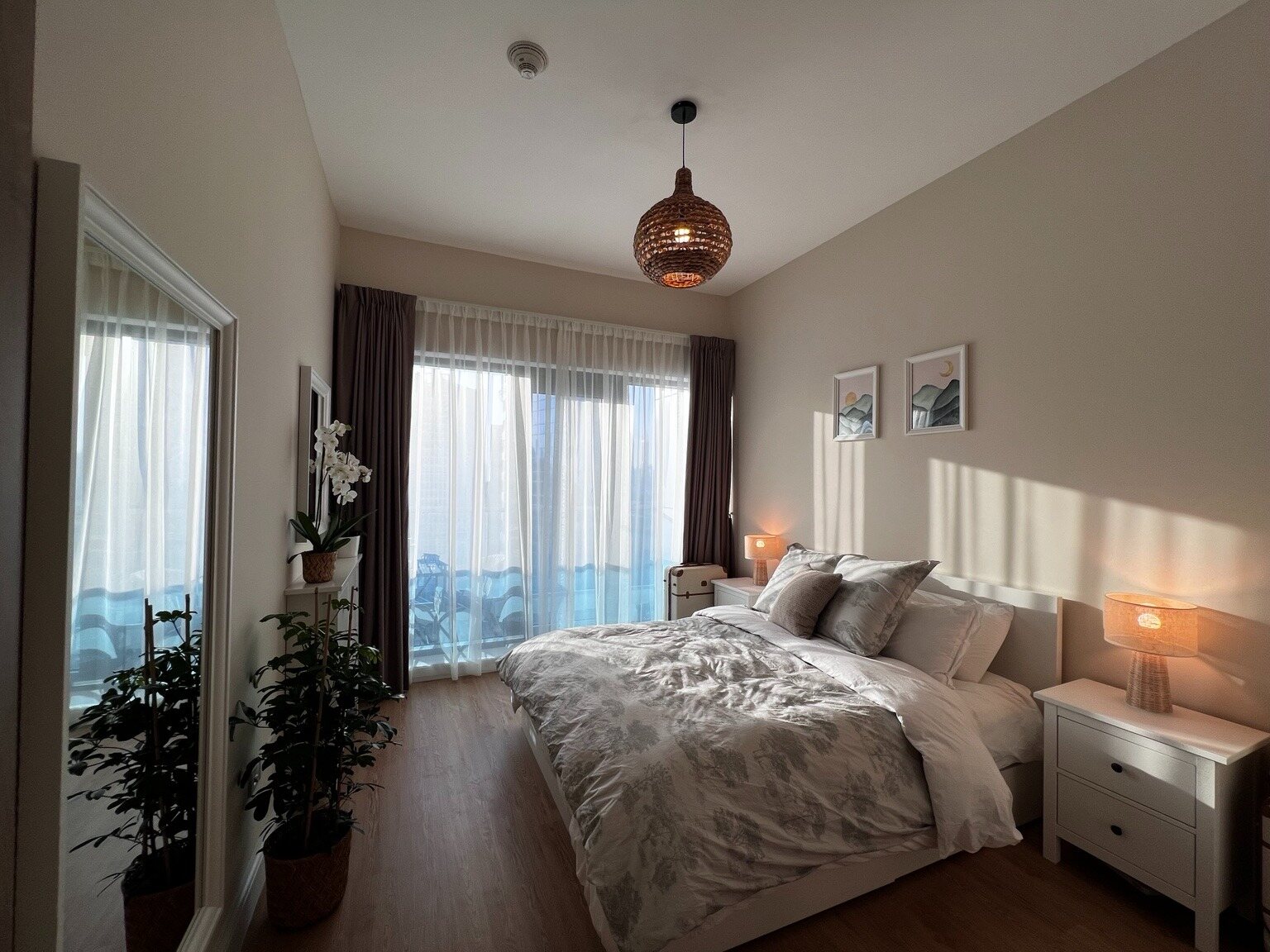 Bedroom with queen bed and balcony access
